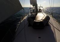 sailing yacht dinghy at deck of sailing yacht bavaria 46 safety net sails
